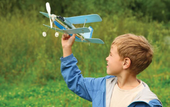 Boy playing with airplane